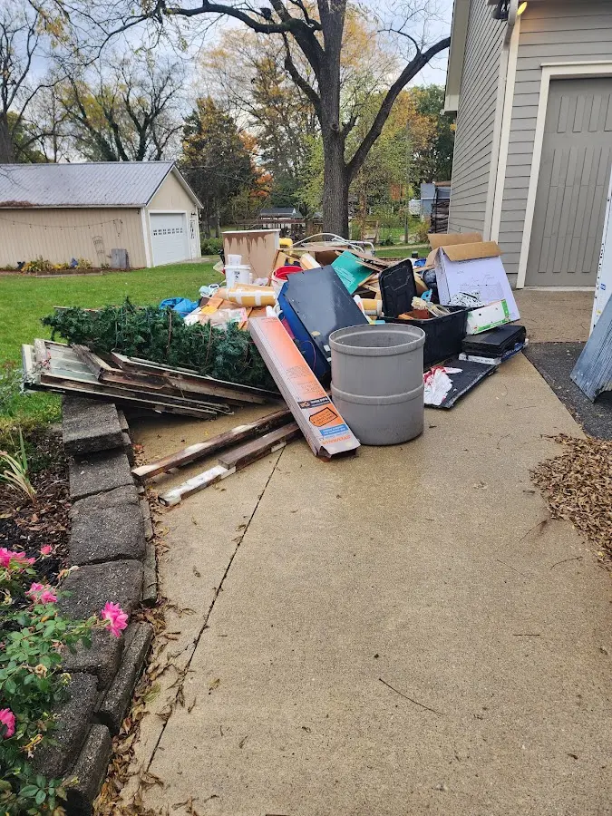 Dumpster being loaded with debris for Residential Dumpster Rental in Essex